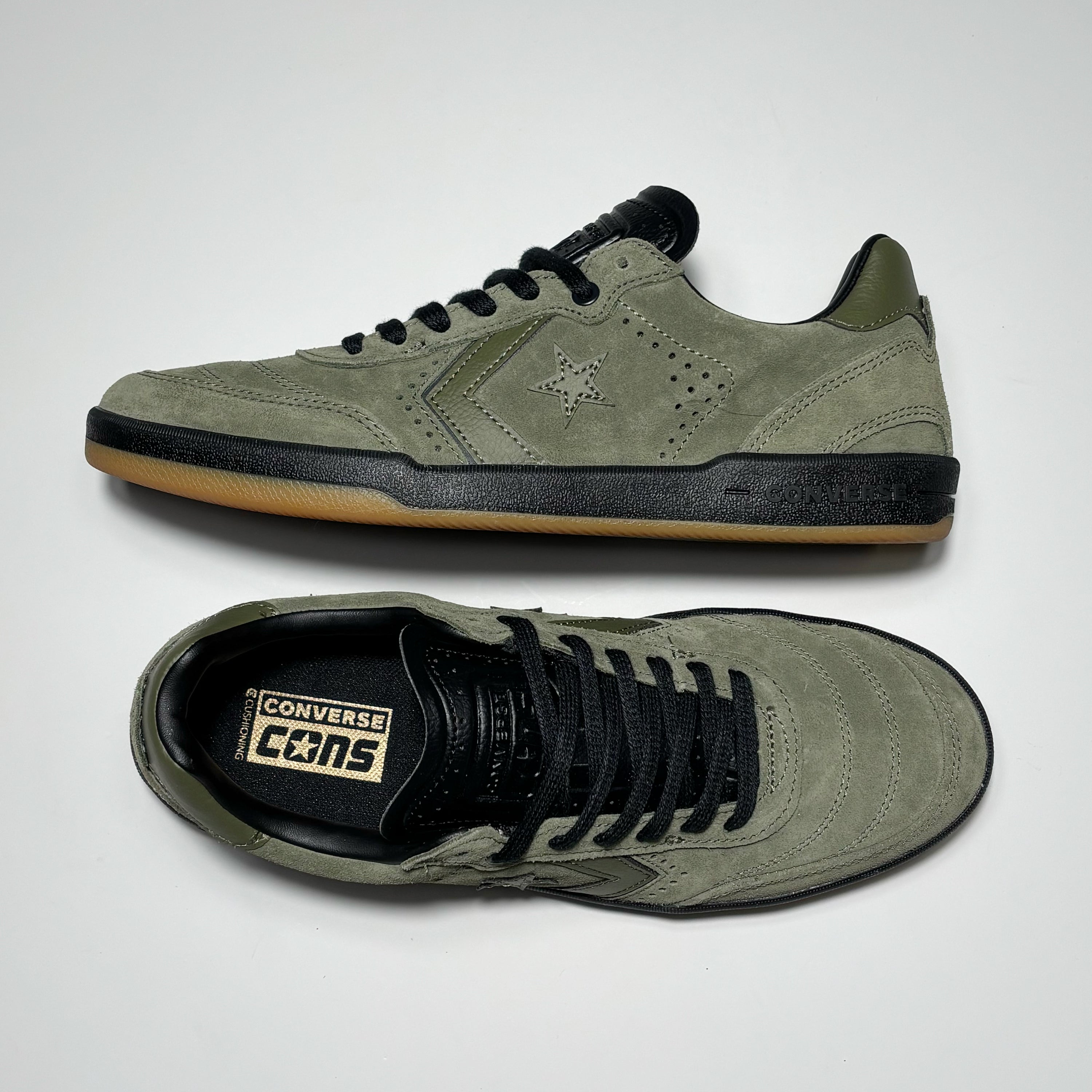 Toe down view with side profile.
Converse cons branding embossed on tongue.