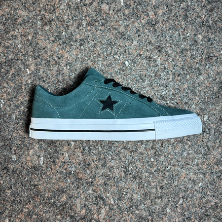 Full side image of right shoe.
Green suede with black star logo and laces.