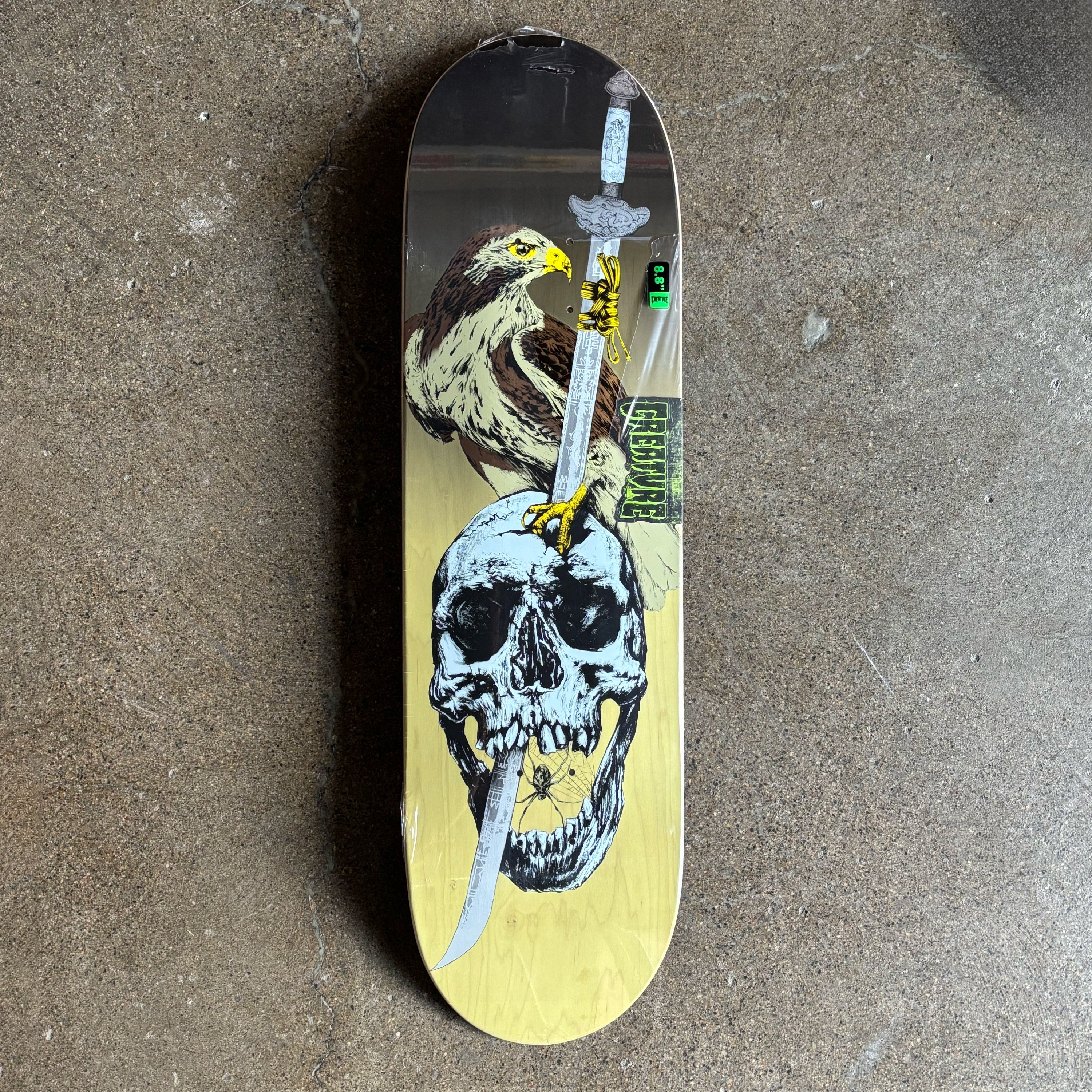 Full image of deck.
Falcon with blade going through a skull