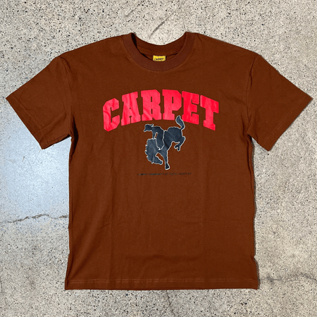 Full front image of tee.
Carpet in red with black silhouette of cowboy on a horse 