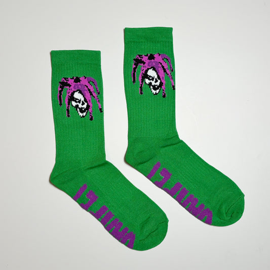 Pair of Carpet Company Season 22 Jester Socks in green.