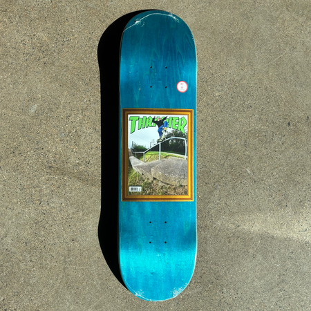 Full image of deck. Thrasher magazine cover centered art on blue veneer.