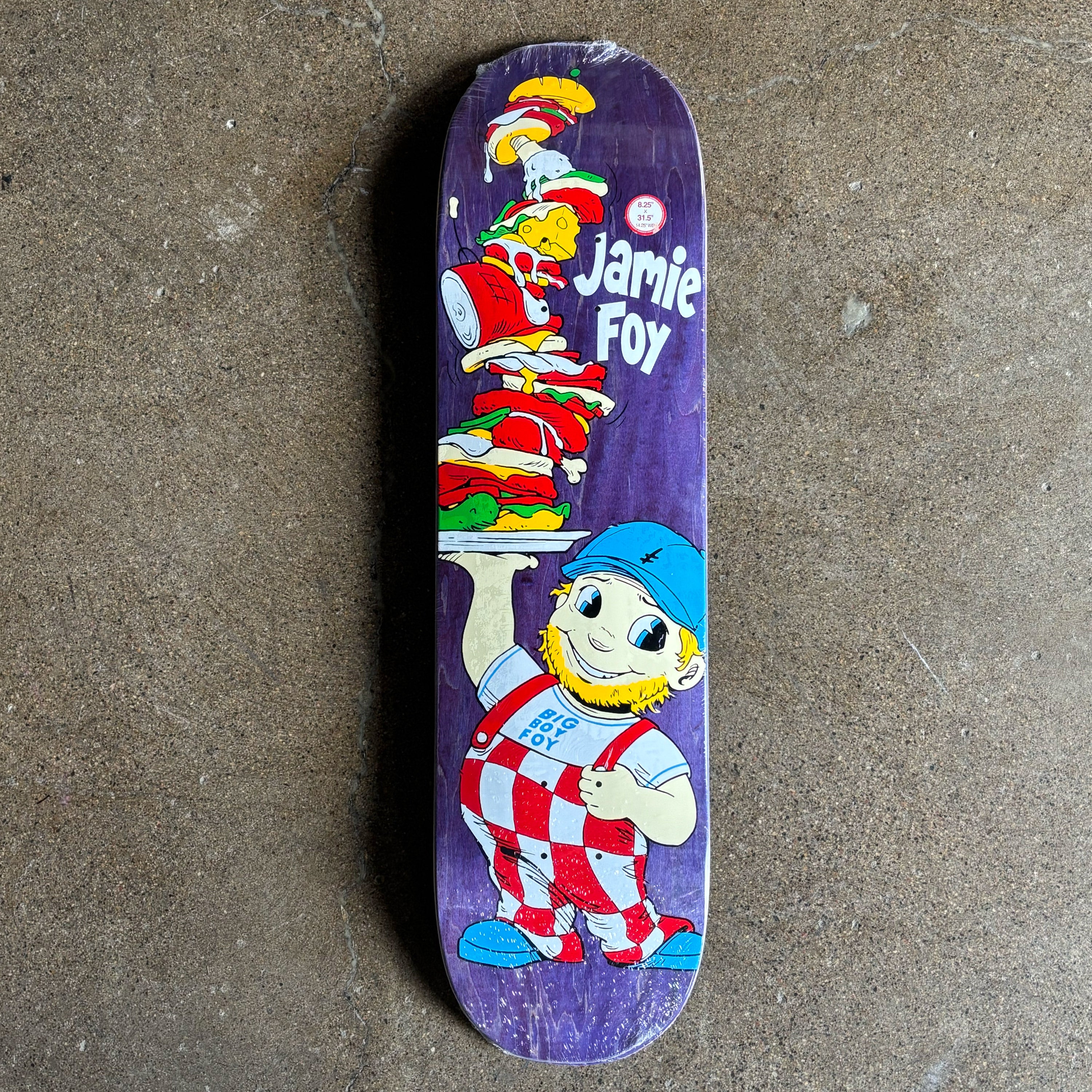 Skateboard deck with cartoon character design and 'Jamie Foy' text on a textured surface