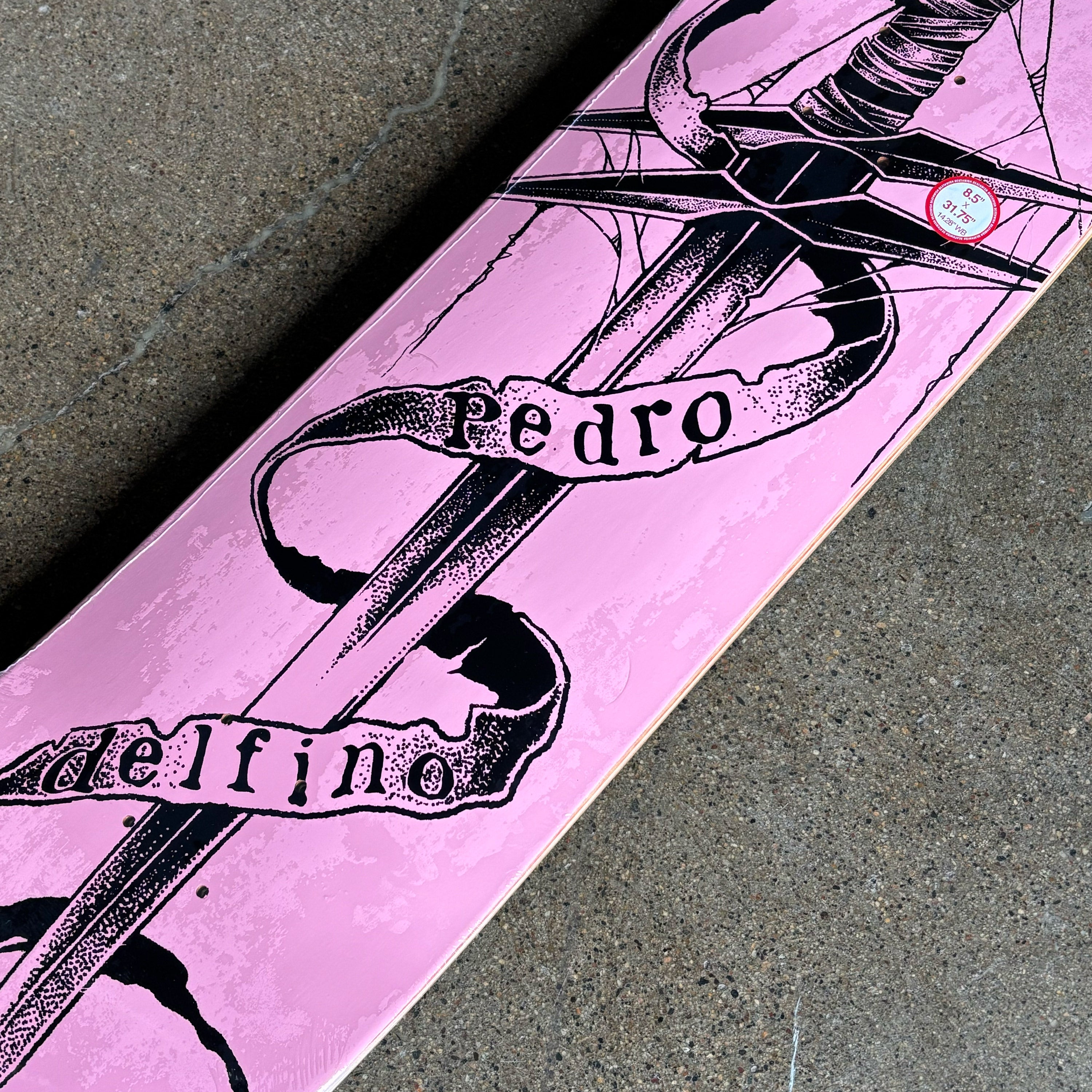 Close detail of black art on pink board.
