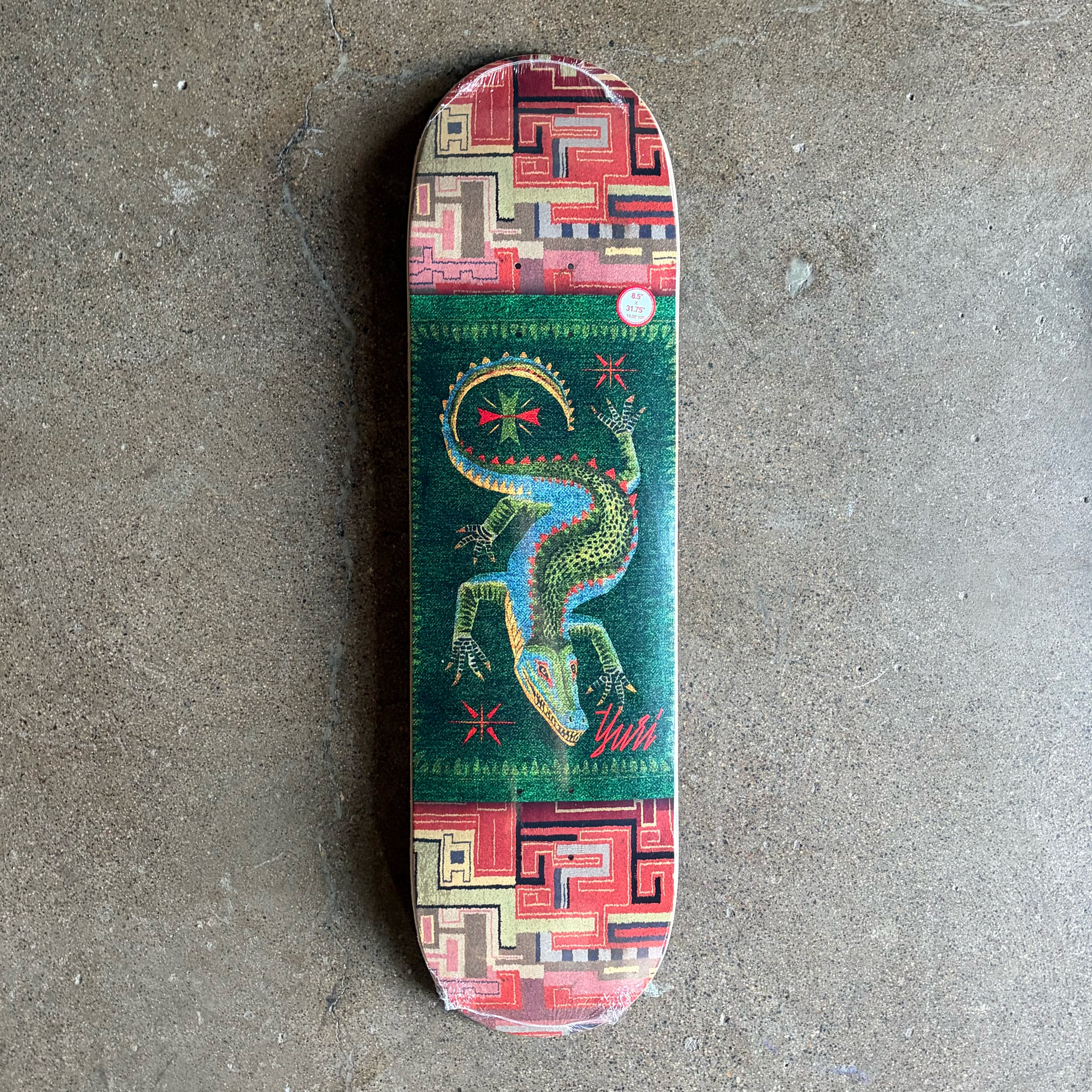 Full image of skateboard deck, woven carpet textile inspired art 