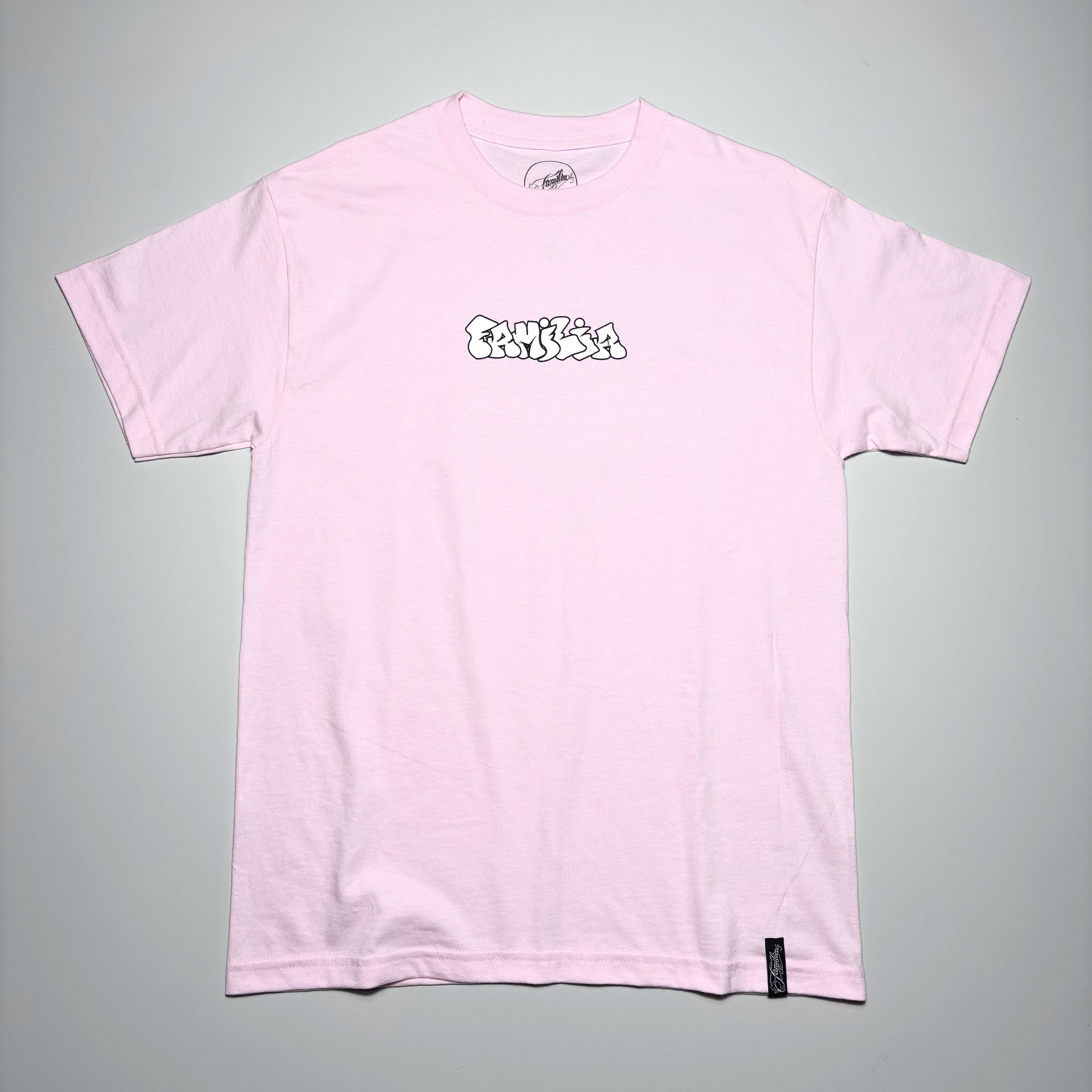 Front image of pink tee with art printed on chest.