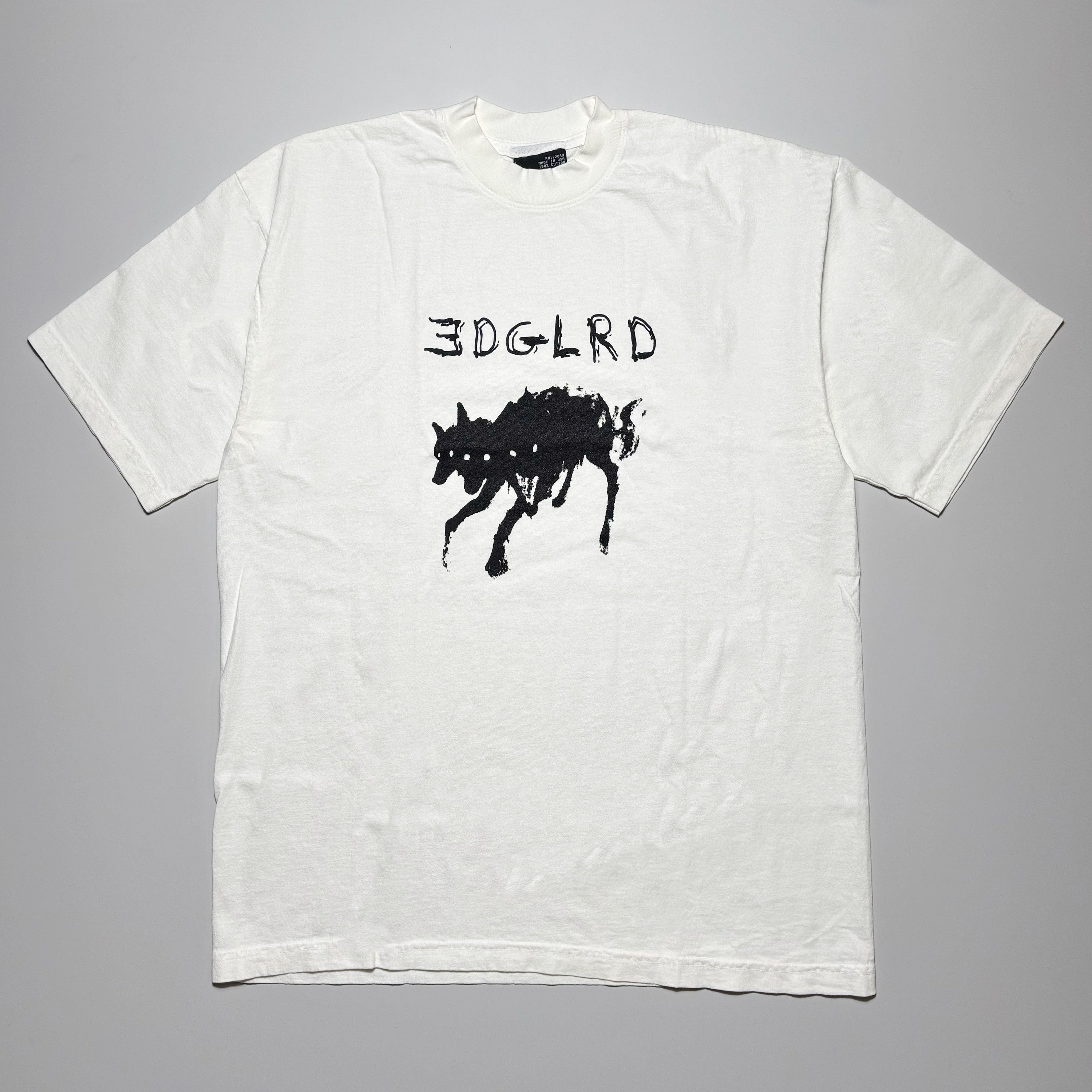 Full image of off-white tee with black printed hell dog on front.