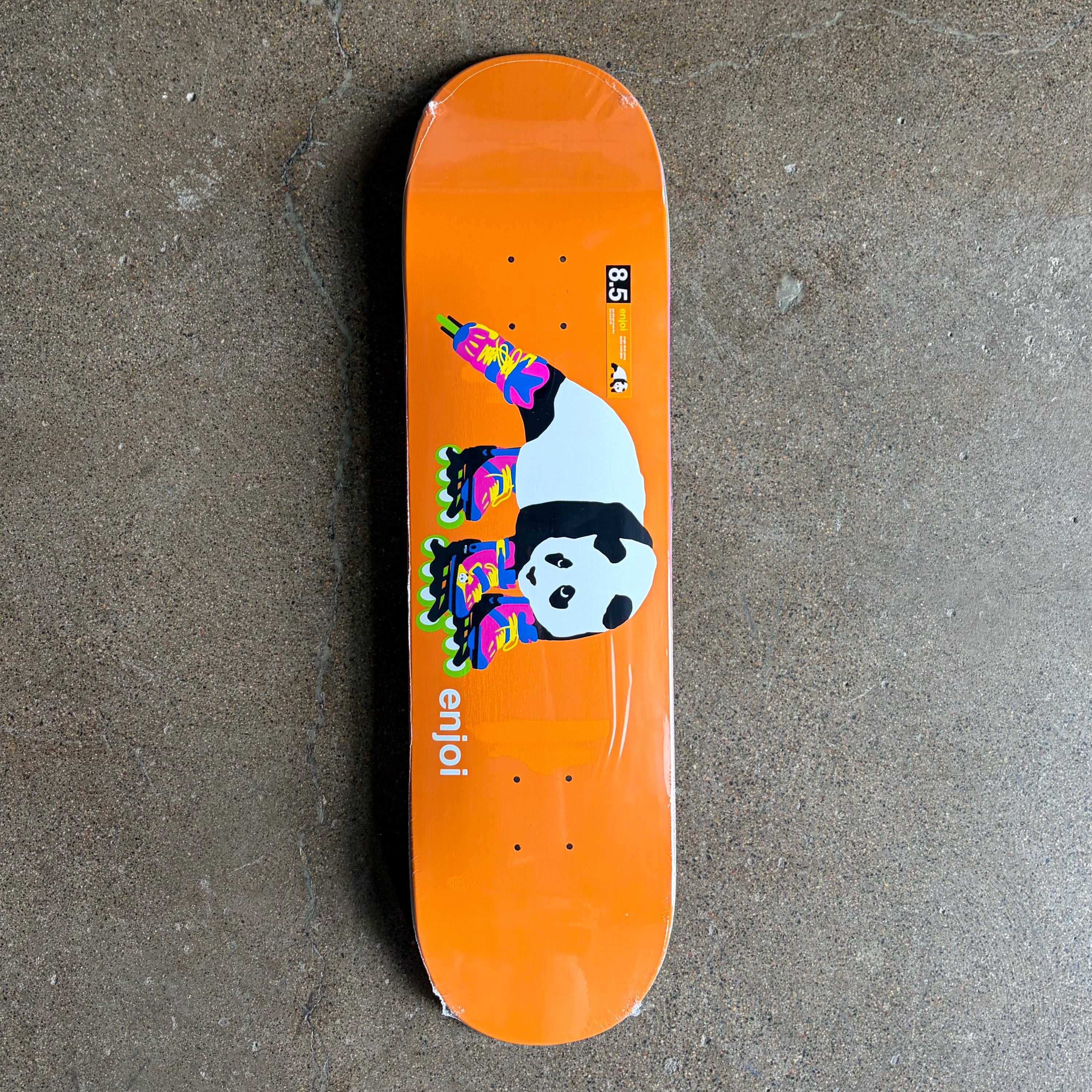 Full image of Enjoi skateboard deck.
Panda with roller blades cartoon art on orange backgroud.