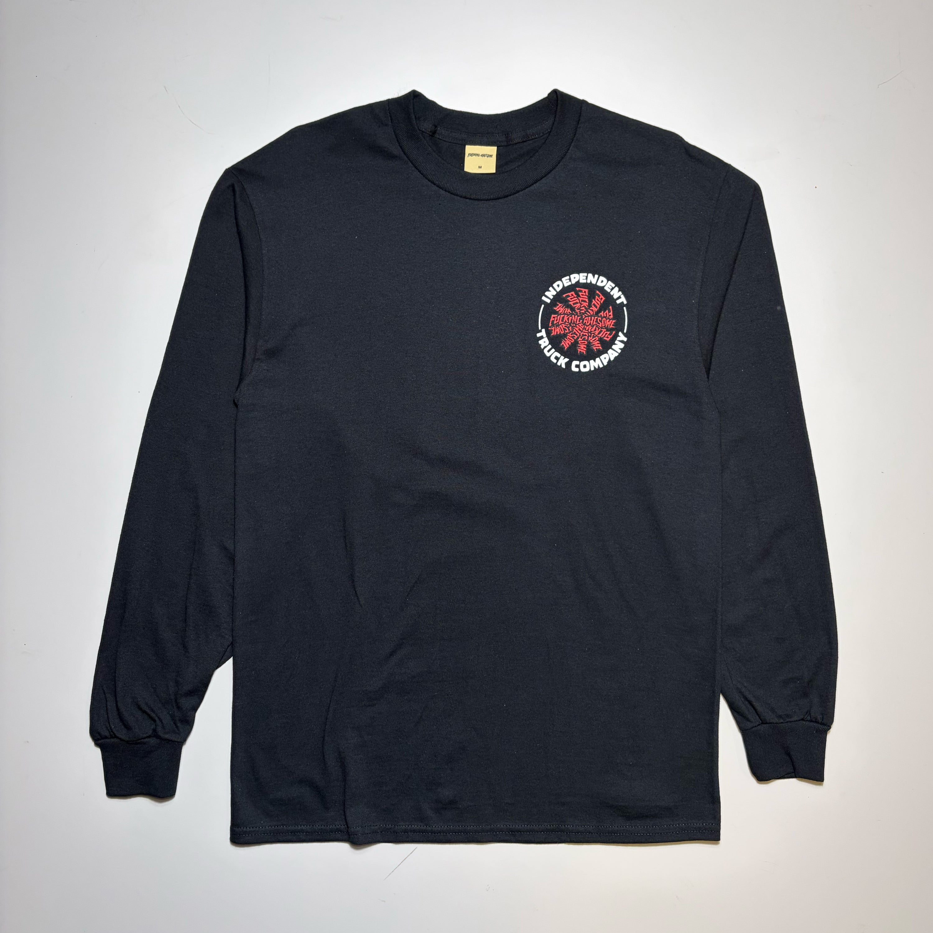 Full image of black fucking awesome brand long sleeve with Independent Truck Company bold text in white.  
