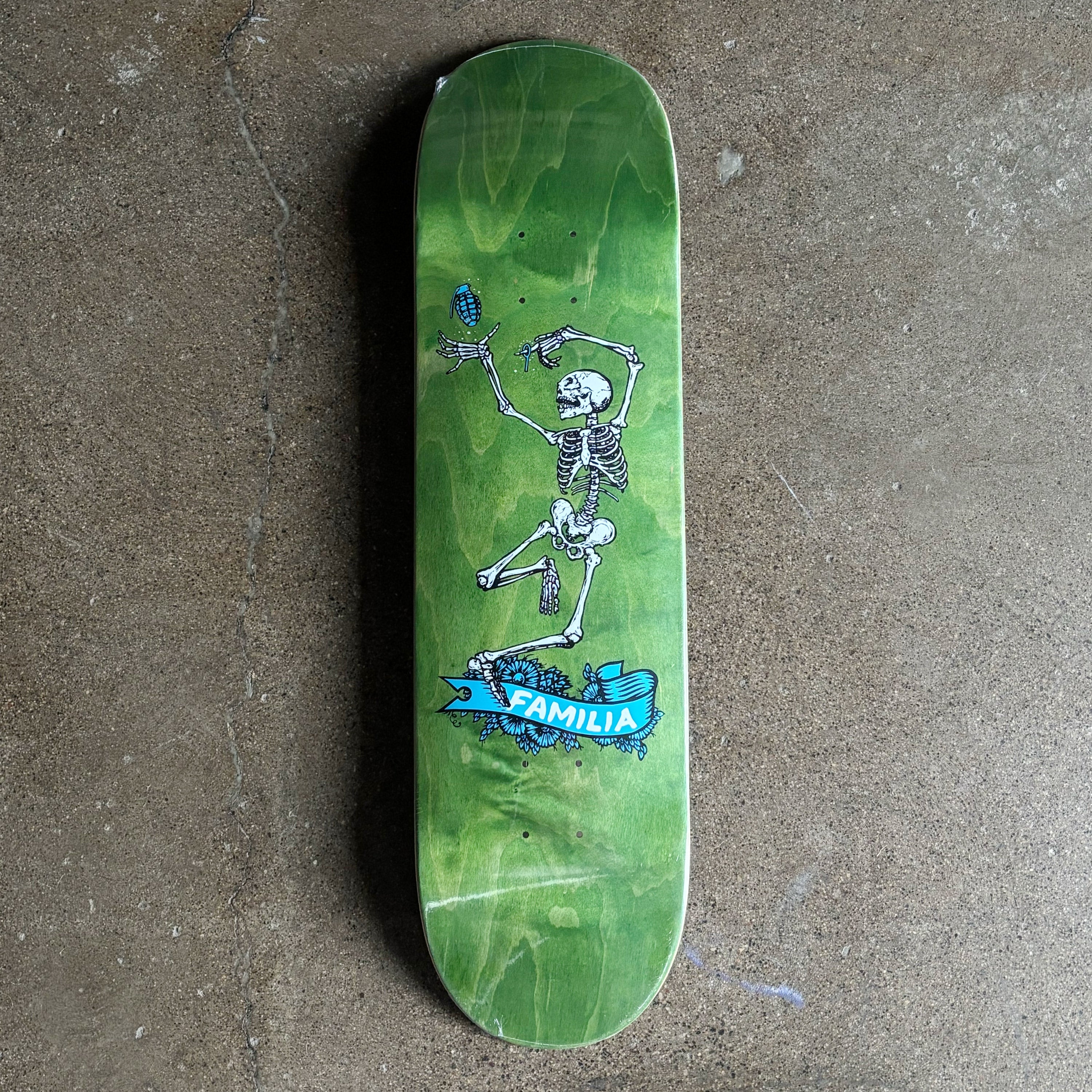 Full image of green veneer stained deck with skeleton art.