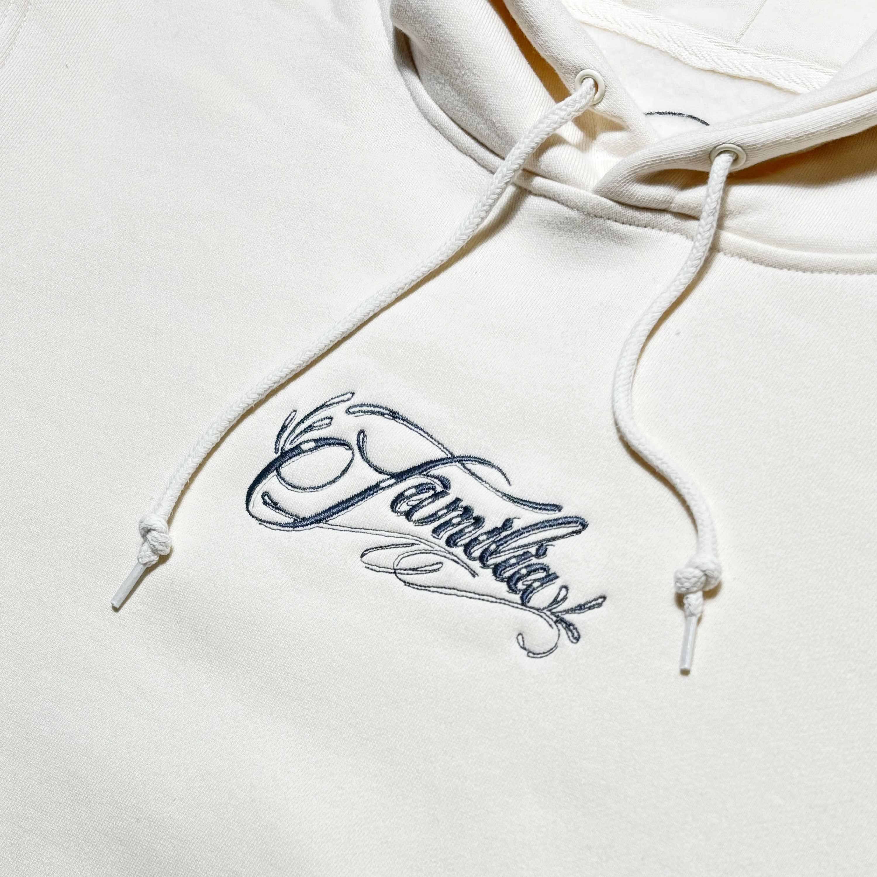 Close detail of embroidered script 