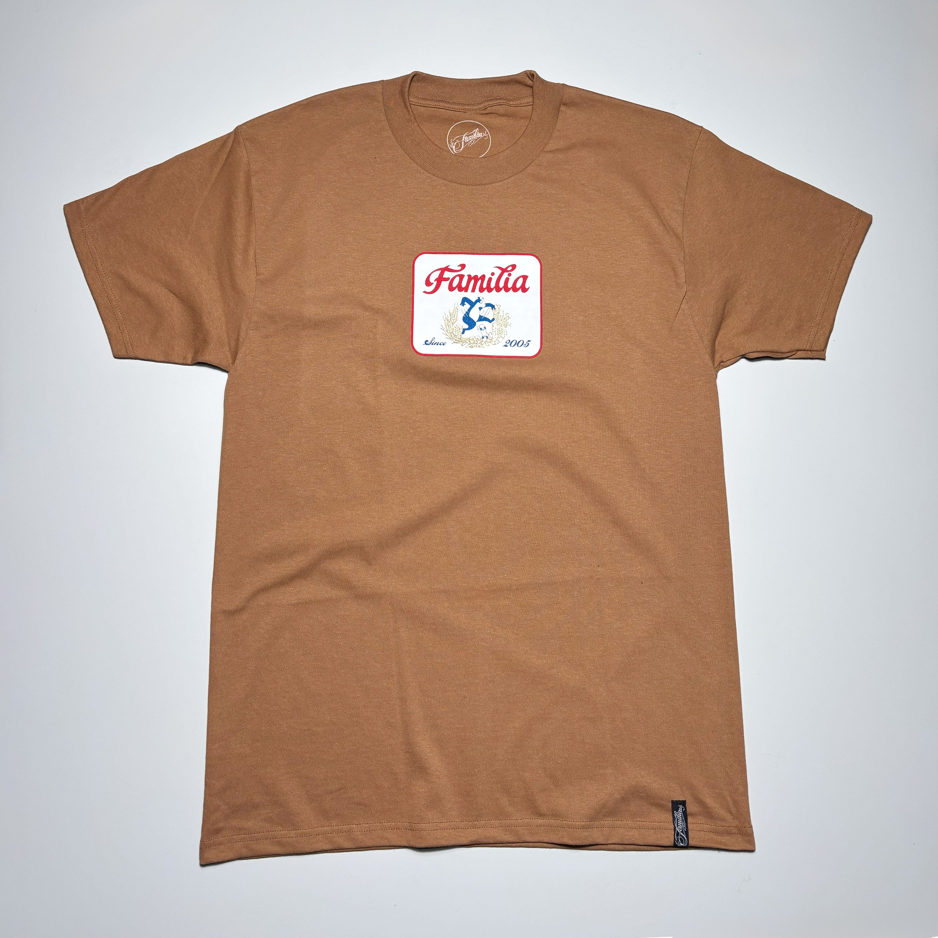Full image of brown tee with art printed on chest.