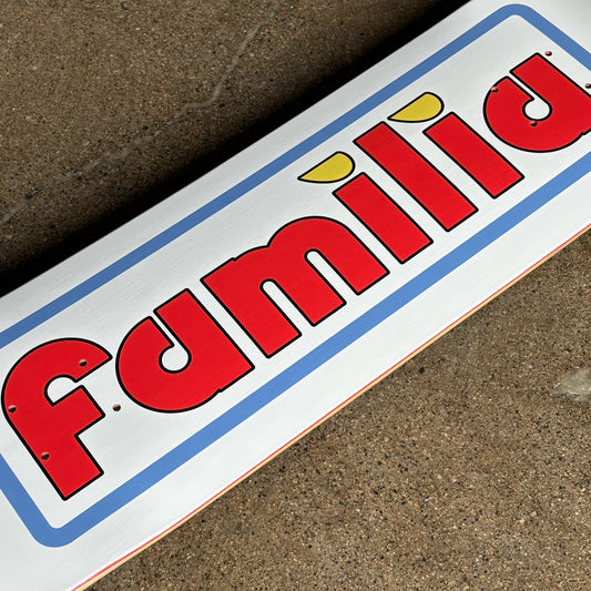 Close detail of Familia font in red with blue outline on white background.