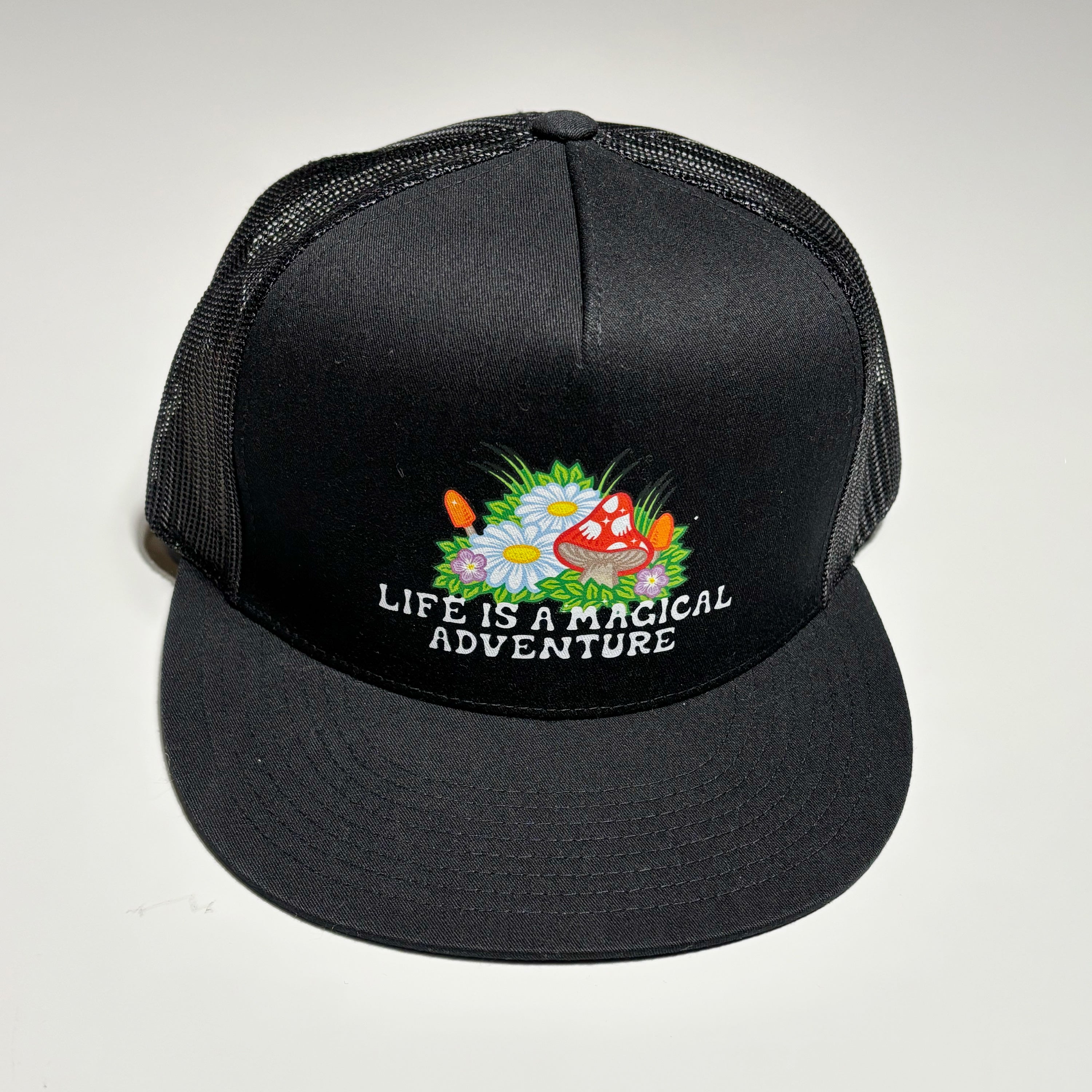 Front image of black hat with art transfer on crown.