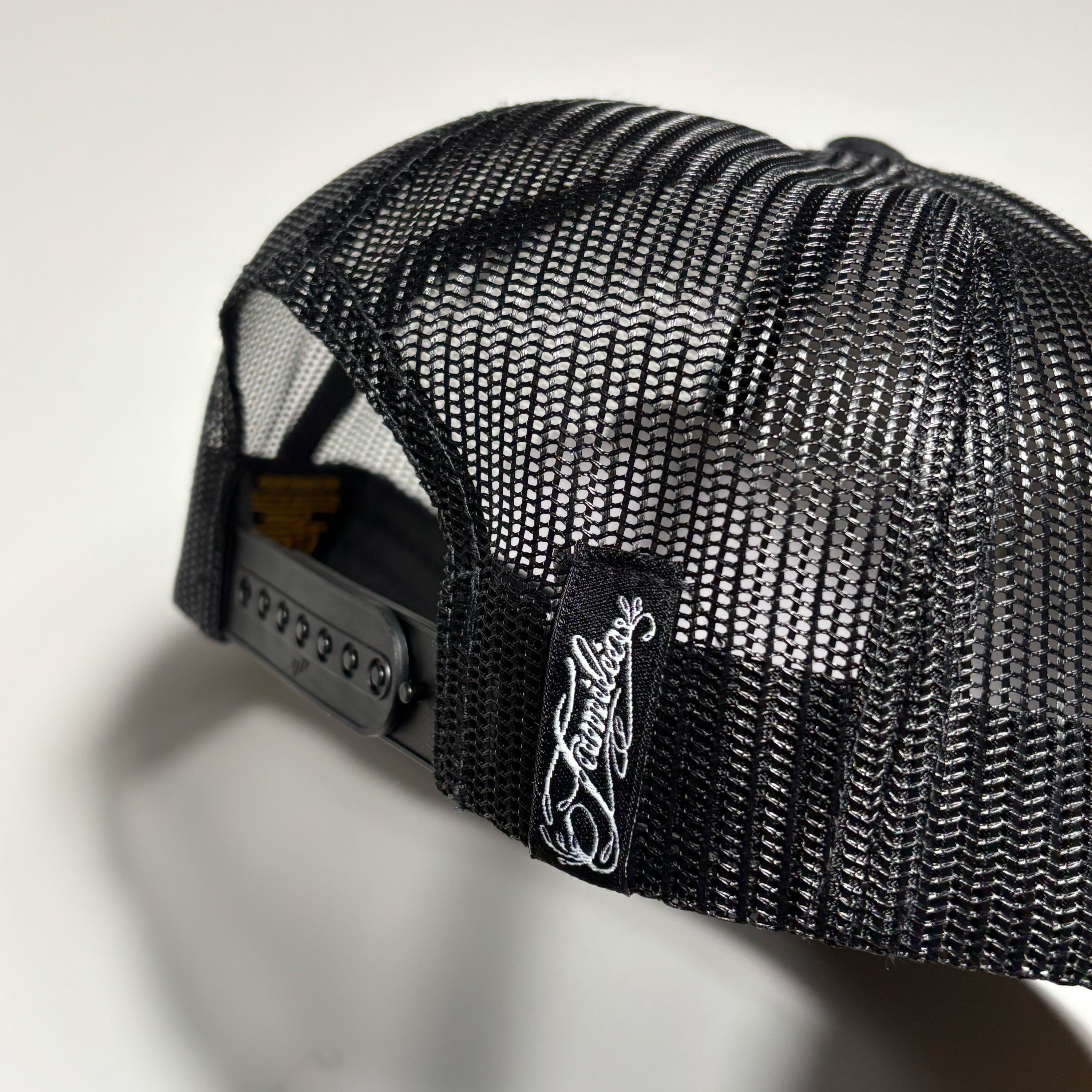 Snapback closure with woven label.