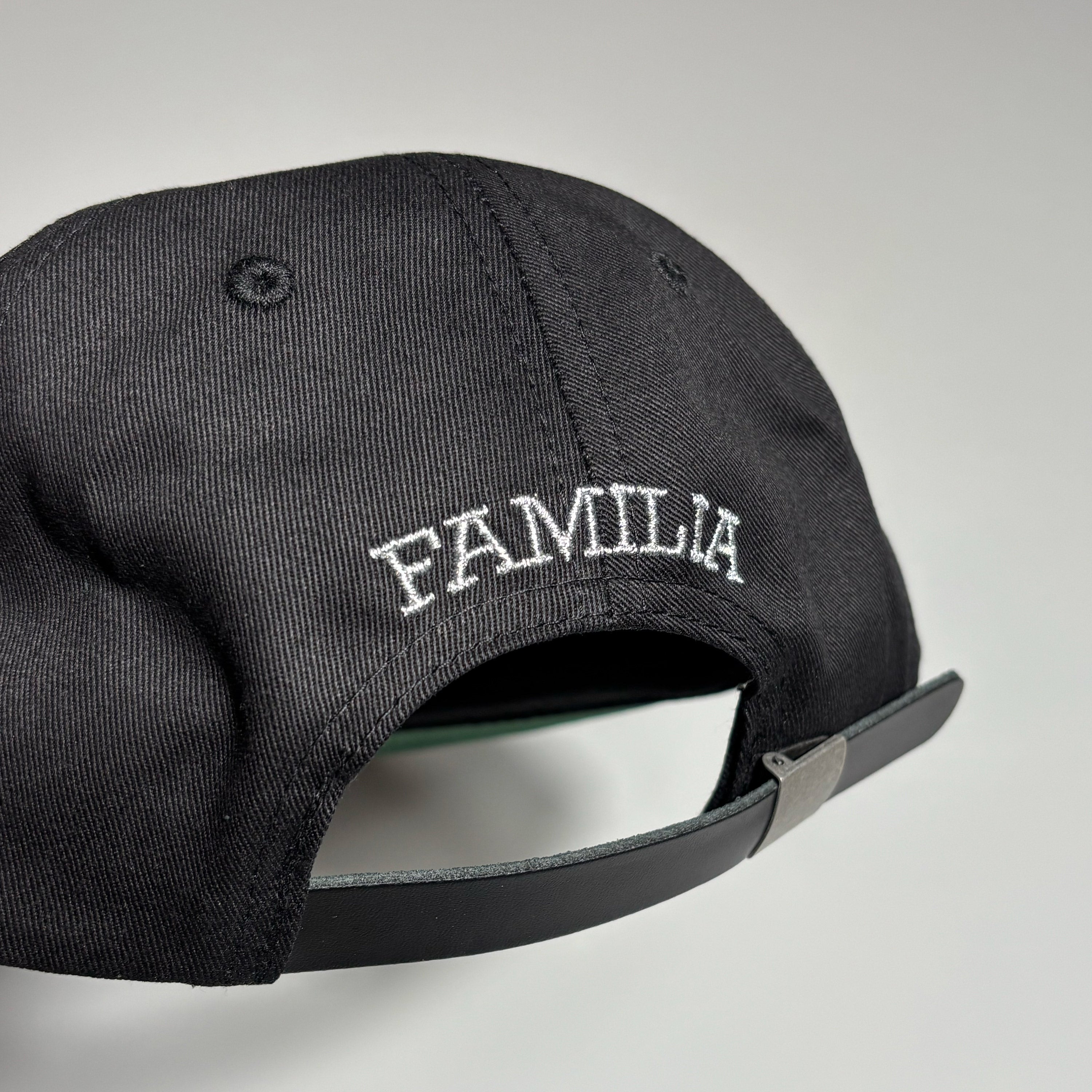 Metallic silver Familia embroidery on back.