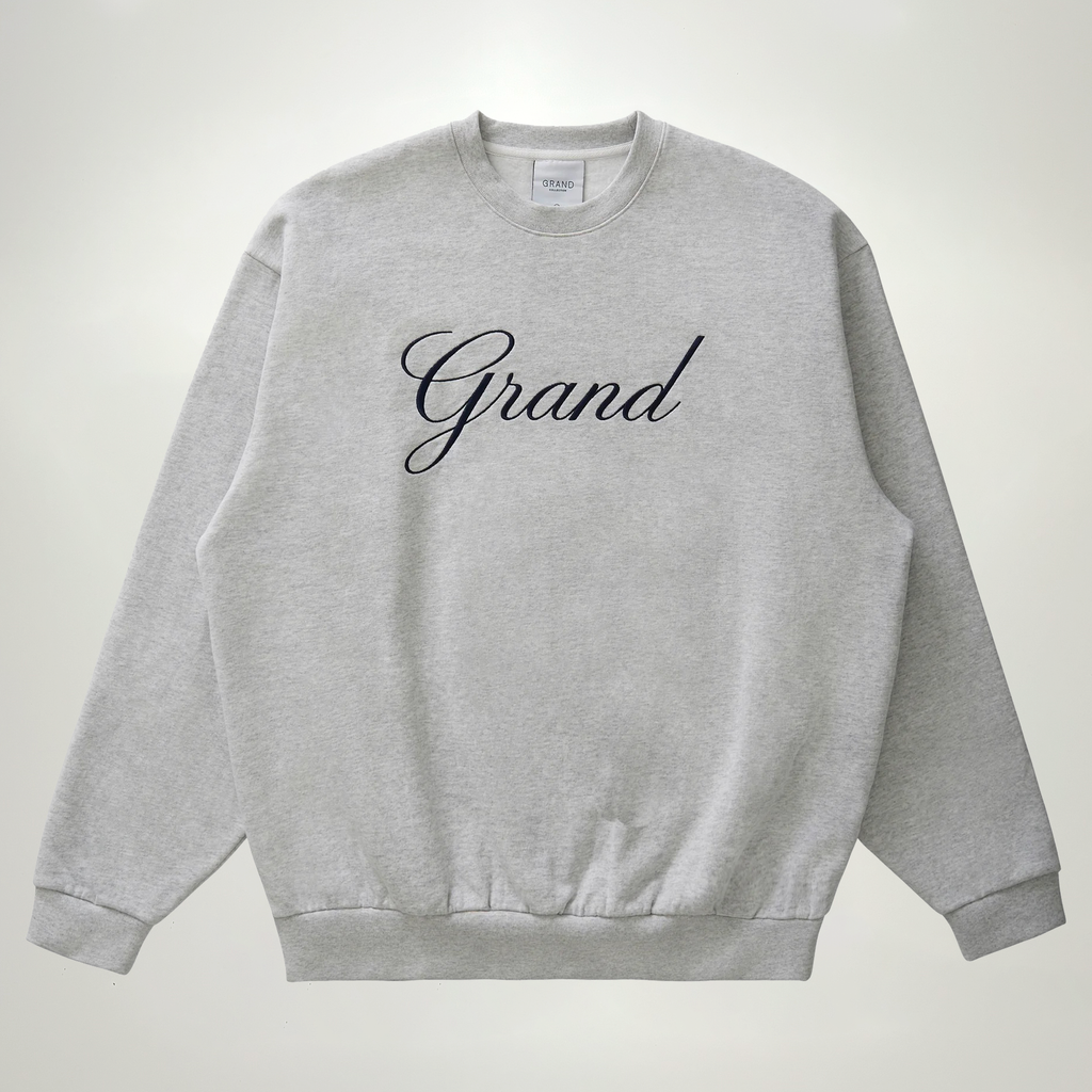 Front image of grey crewneck sweatshirt.
Satin embroidered script on chest.