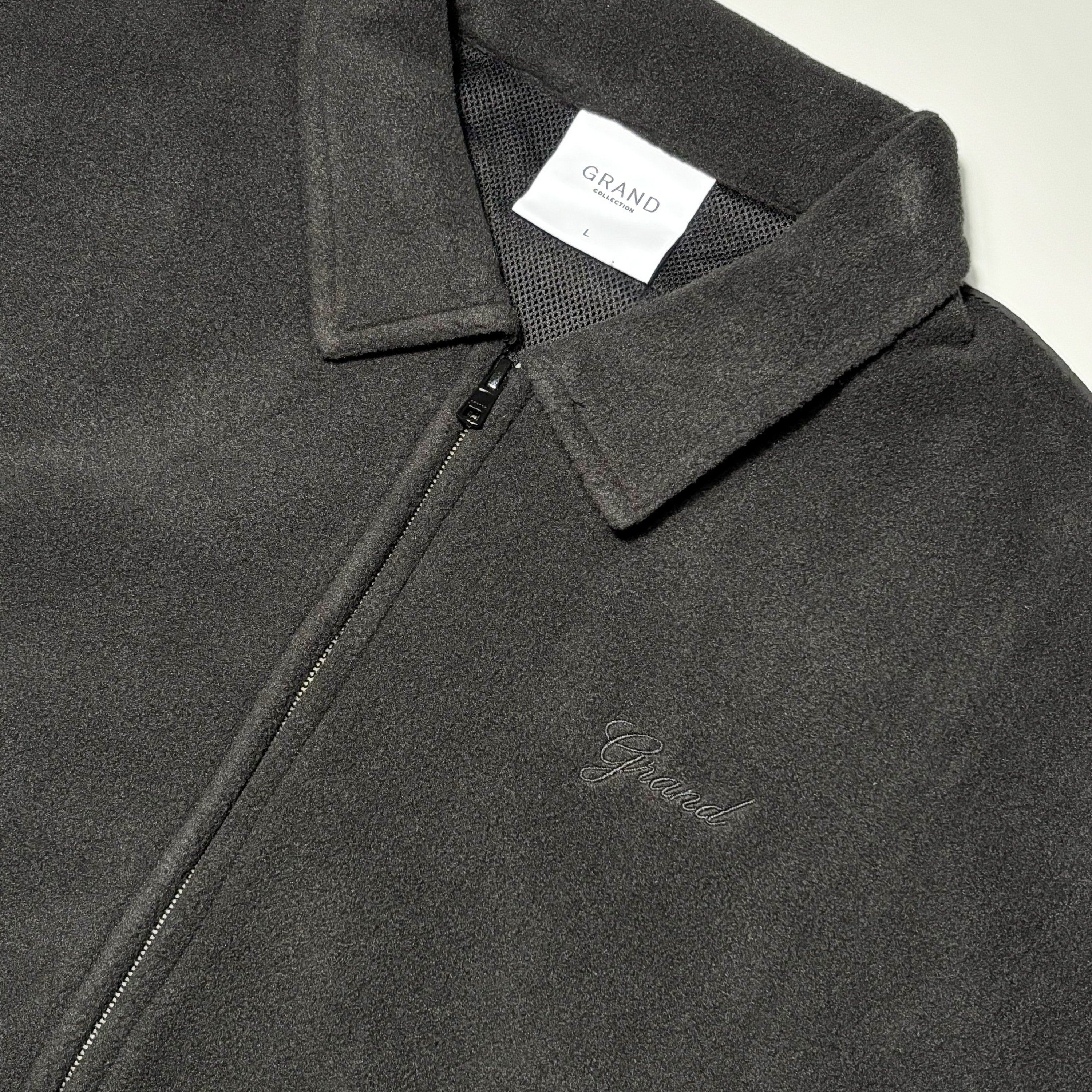 Close detail of grand script embroidery.