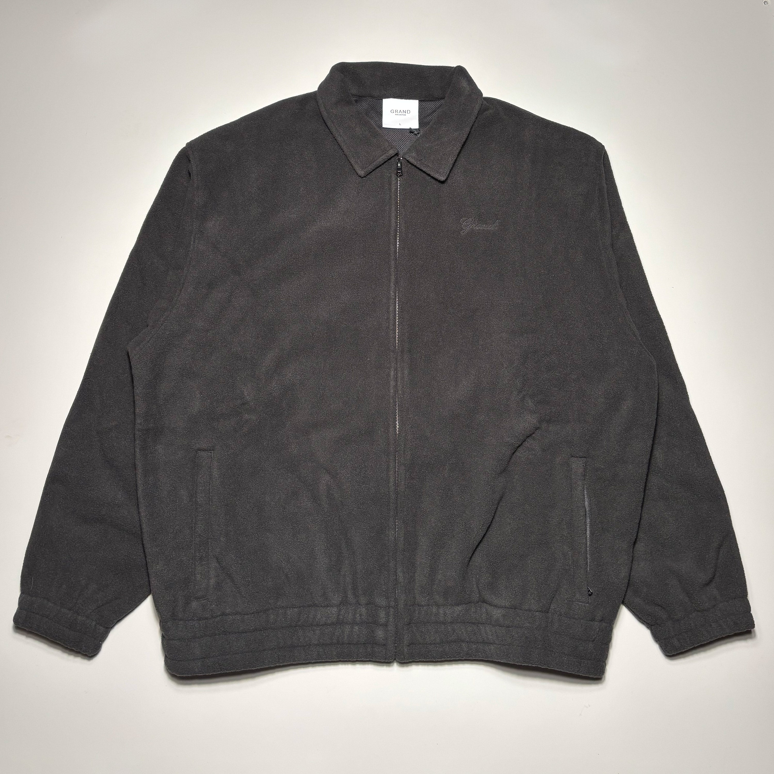 Front image of black polar fleece jacket.