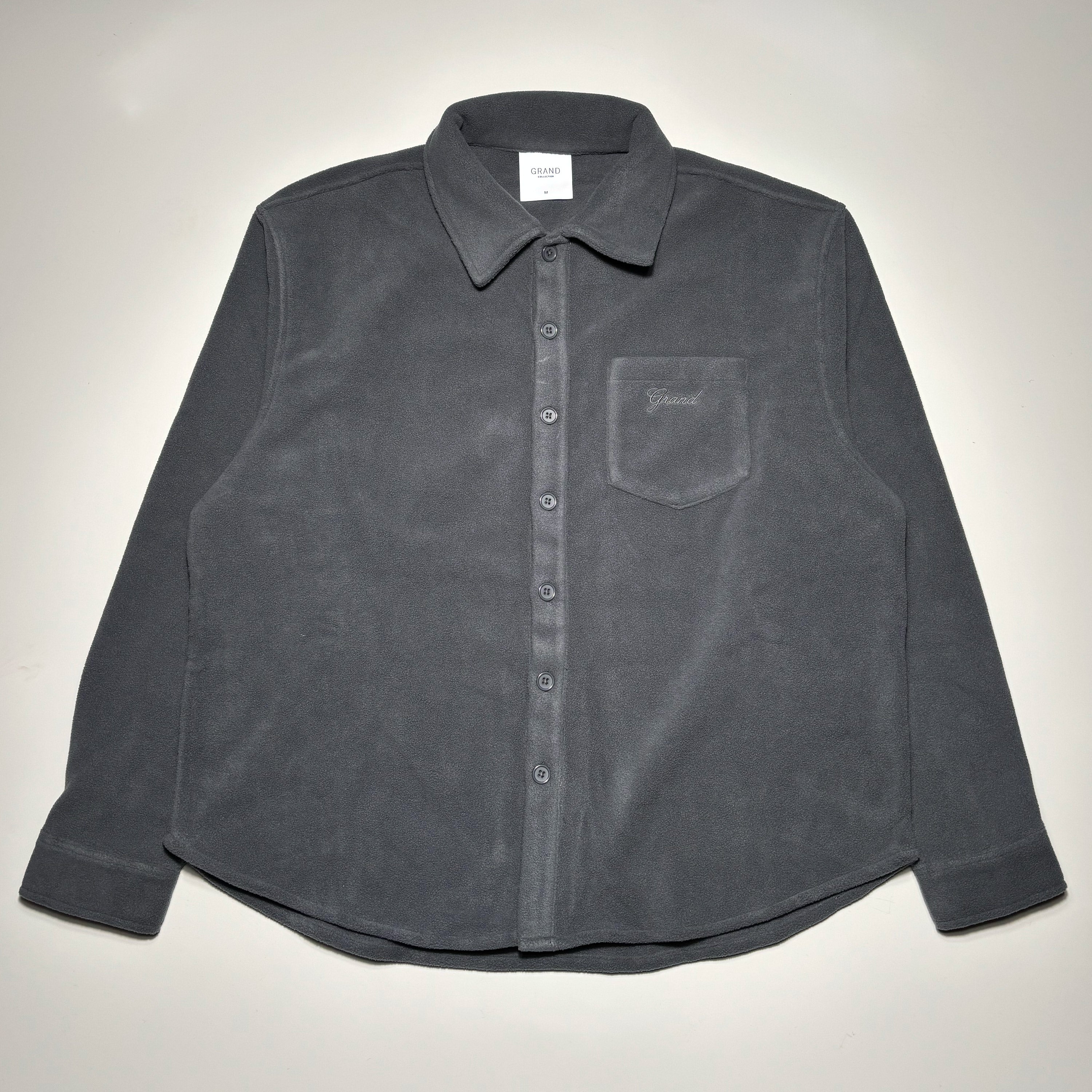 Front image of grey polar fleece button down overshirt.