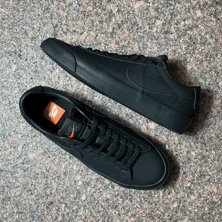 THE GRANT TAYLOR PRO MODEL SHOES FOR NIKE SB IN BLACK LEATHER AND CANVAS WITH BLACK SOLE DISPLAYED ON GRANITE