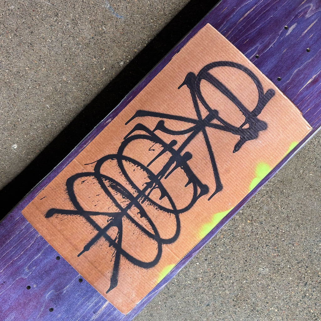 Close detail of spray painted cardboard. 