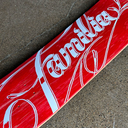 Close detail of script art on red bottom deck.