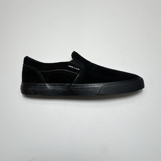 Side image of right shoe, black suede with piping and black outsole.
