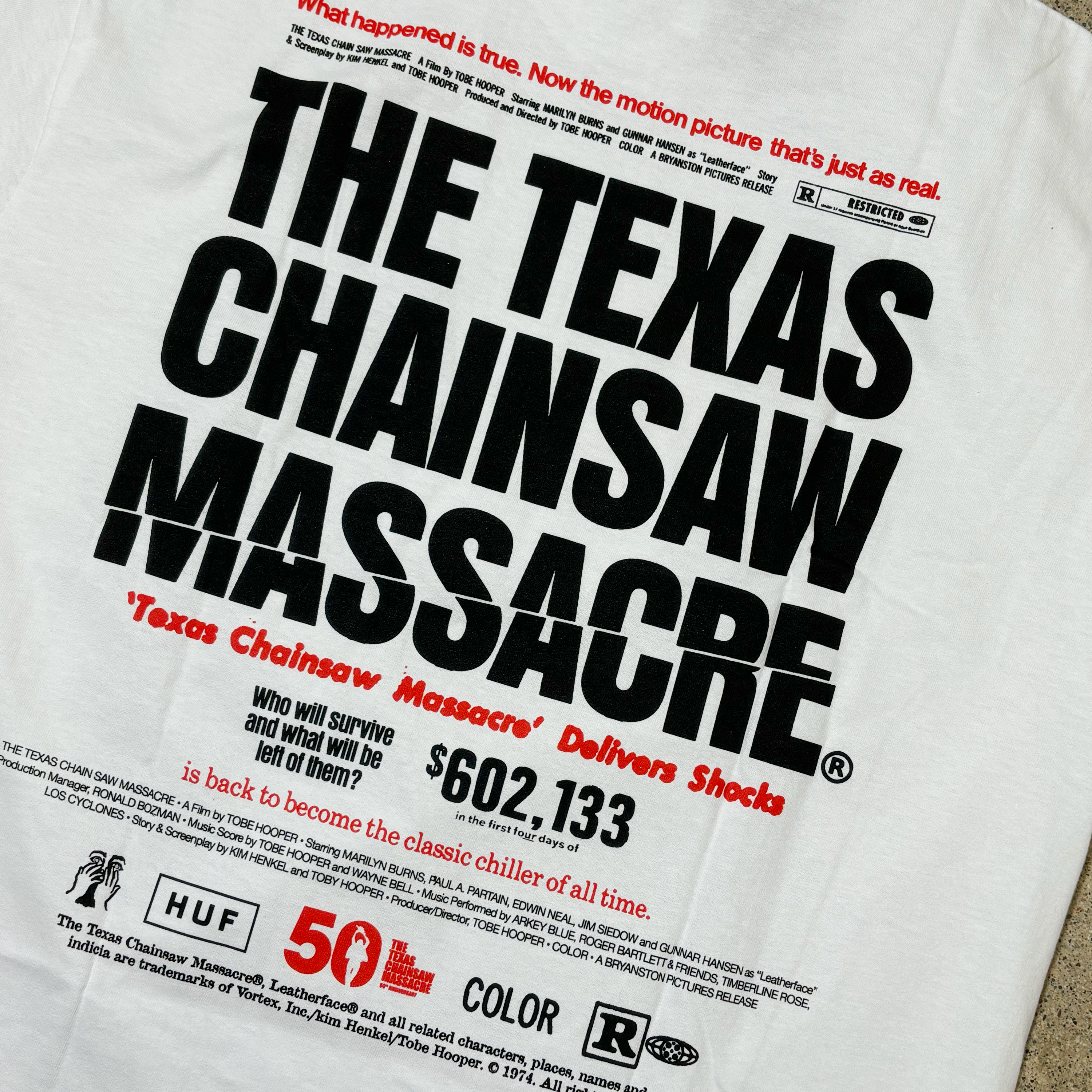 BACK VIEW OF WHITE HUF TEE
THE TEXAS CHAINSAW MASSACRE FONT IN BLACK