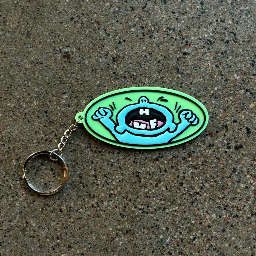 Image of cry baby artwork on rubber key chain.