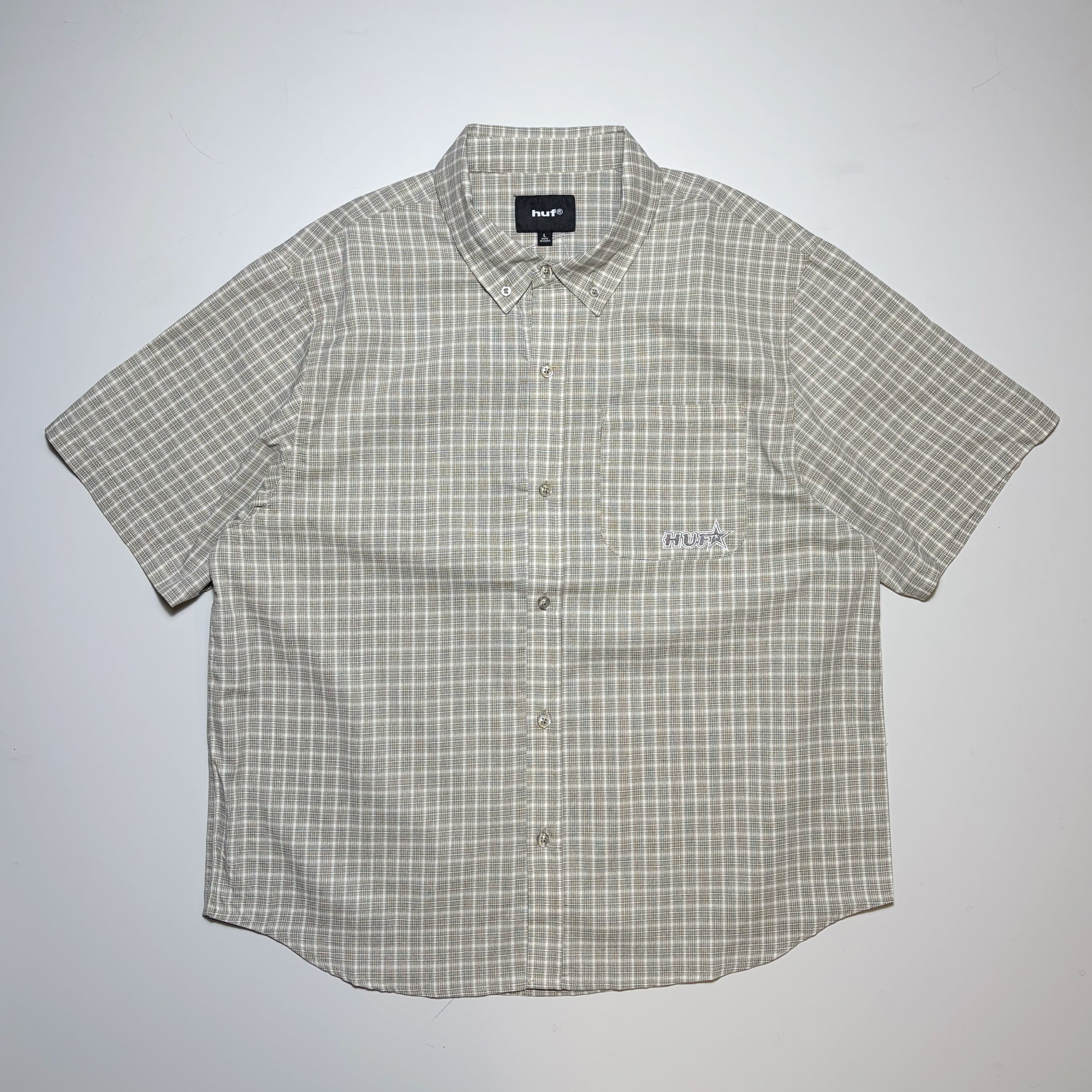 Full image of HUF Galaxy Plaid woven shirt. Embroidered HUF logo on pocket.