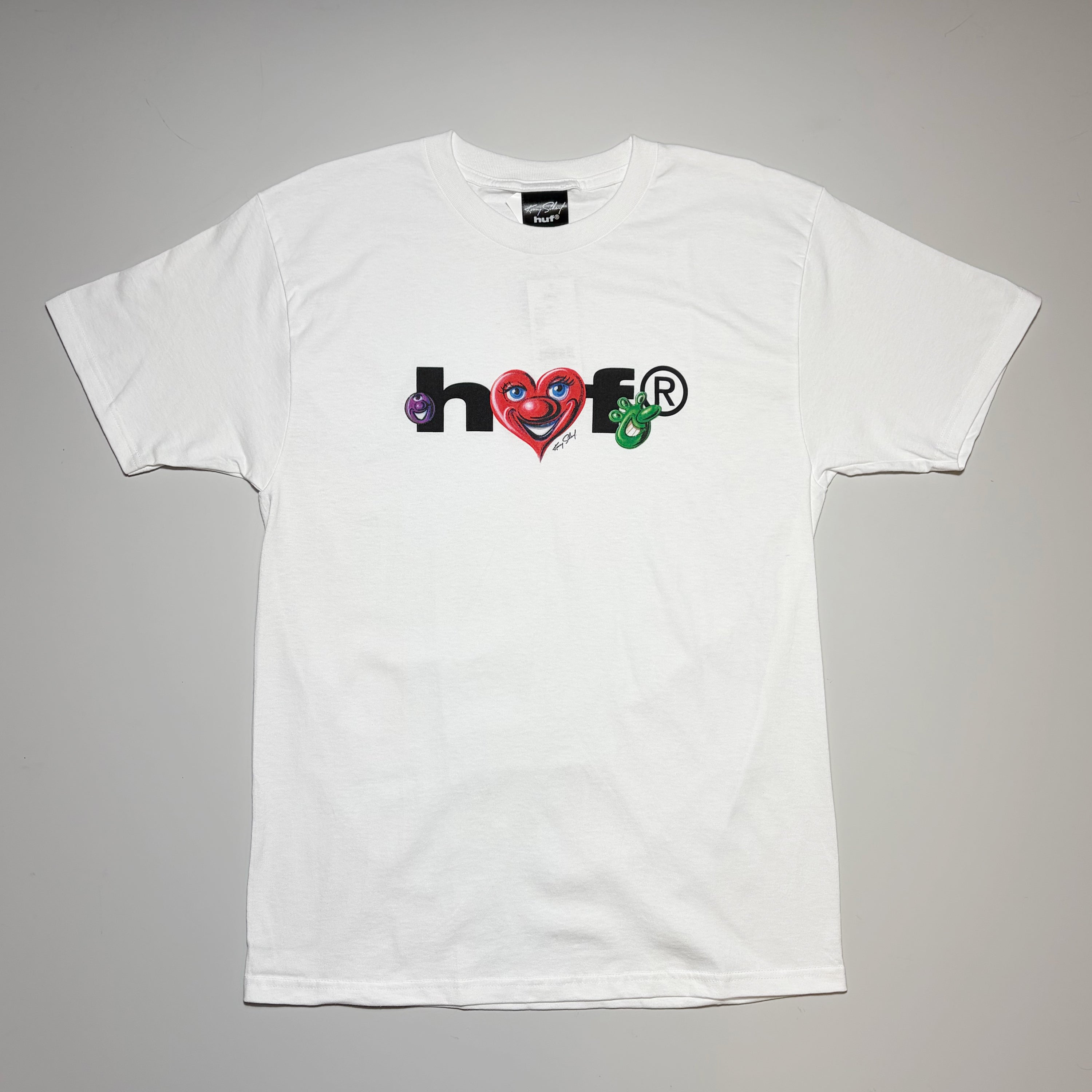 Full front image of white HUF Kenny Scharf Future tee. Airbrush inspired art printed on front.