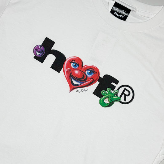 Close detail of airbrush characters with HUF in black text.