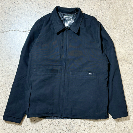 Full image of jacket. Canvas side with chore style pockets. HUF woven label on pocket.