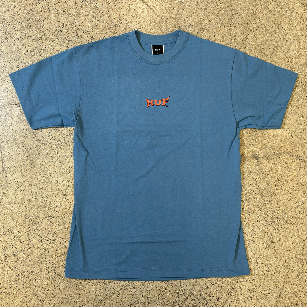 FRONT SIDE BLUE T-SHIRT, ORANGE FONT GRAPHIC CENTER CHEST THAT READS HUF 