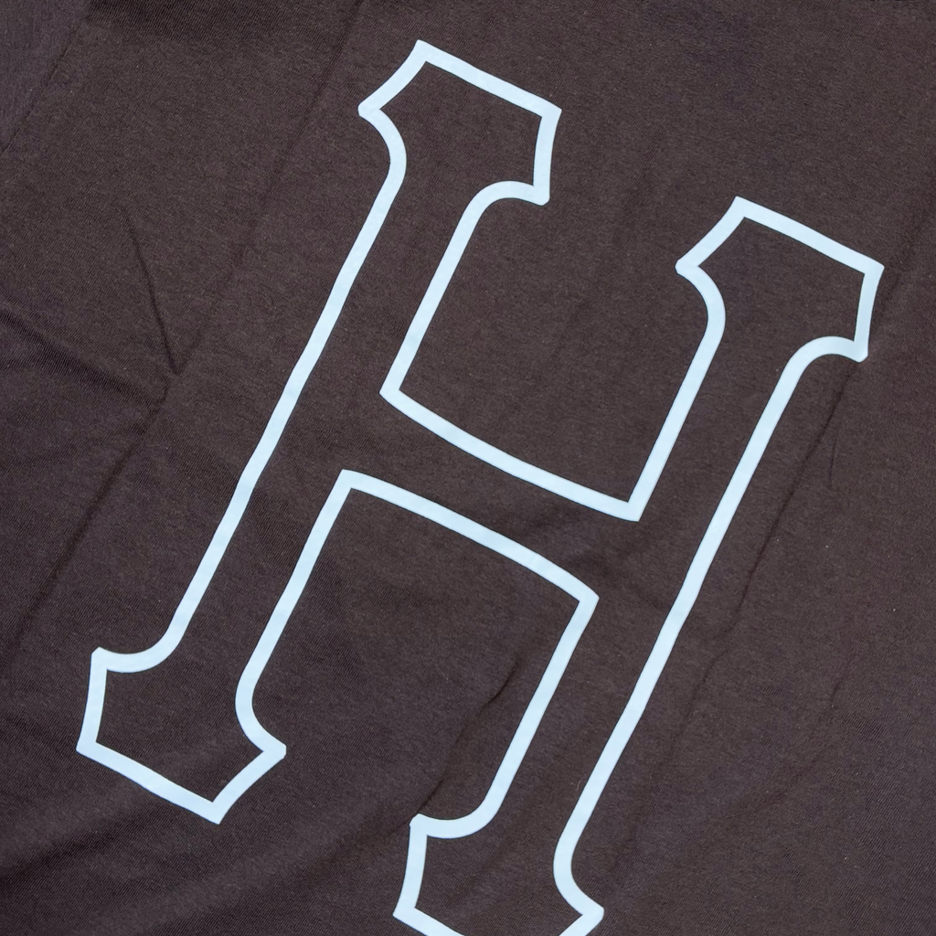 Detail of white printed H on back of espresso color  tee