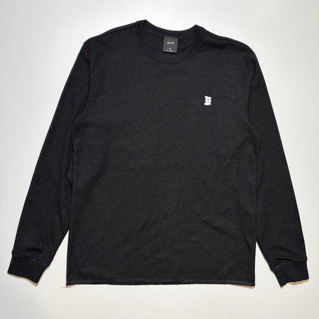 Front image of black thermal with embroidered logo on chest.