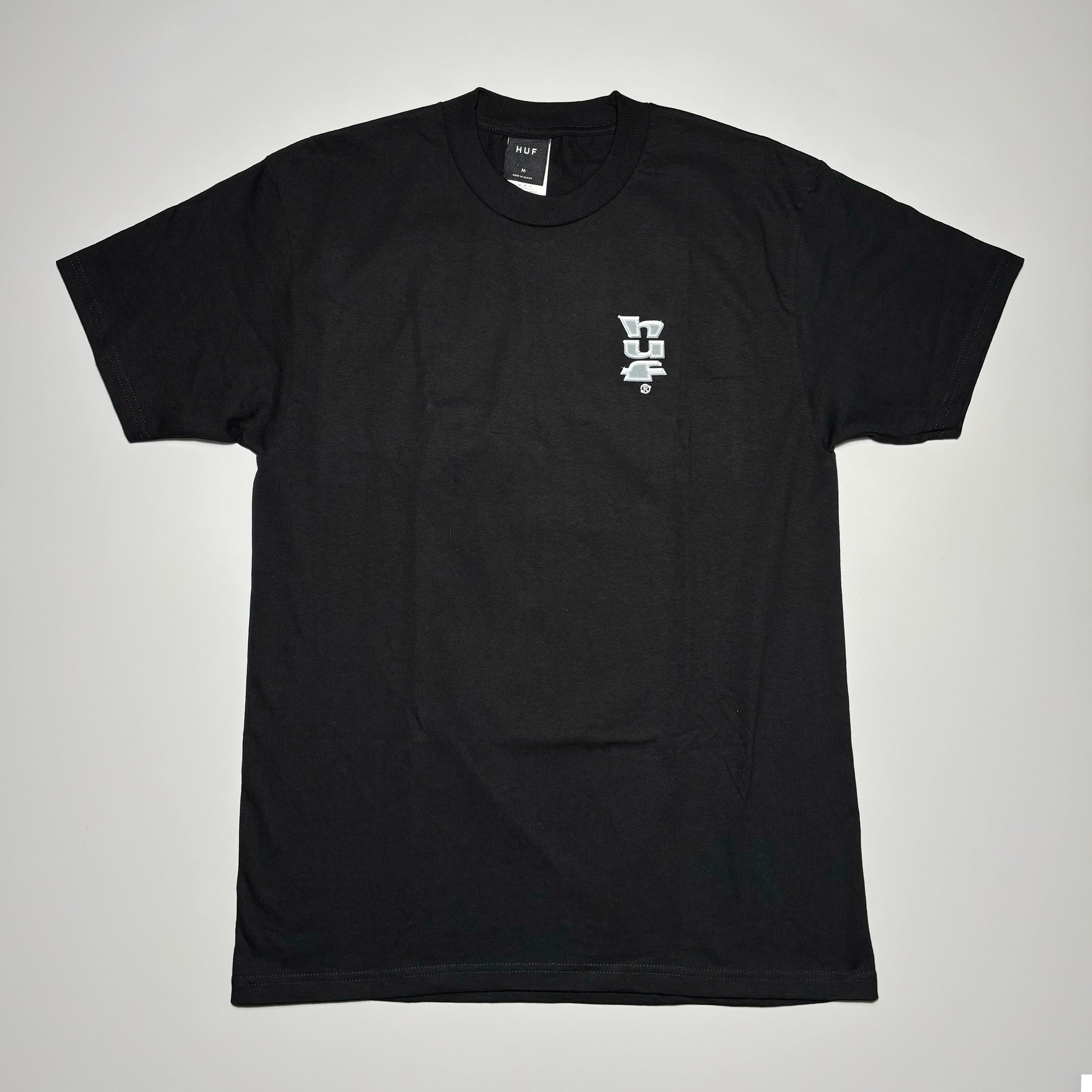 Full image of black tee with printed art in chest.