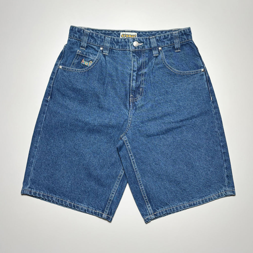 Front image of jean shorts in indigo blue with HUF embroidered on right pocket.