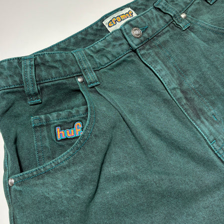 Close detail of embroidered detail and sea green wash.