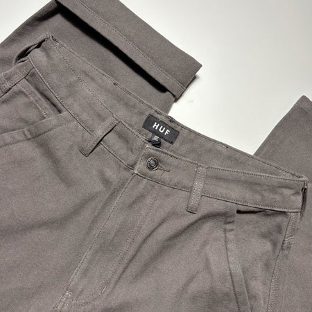 Close detail of side cut pockets and custom button.