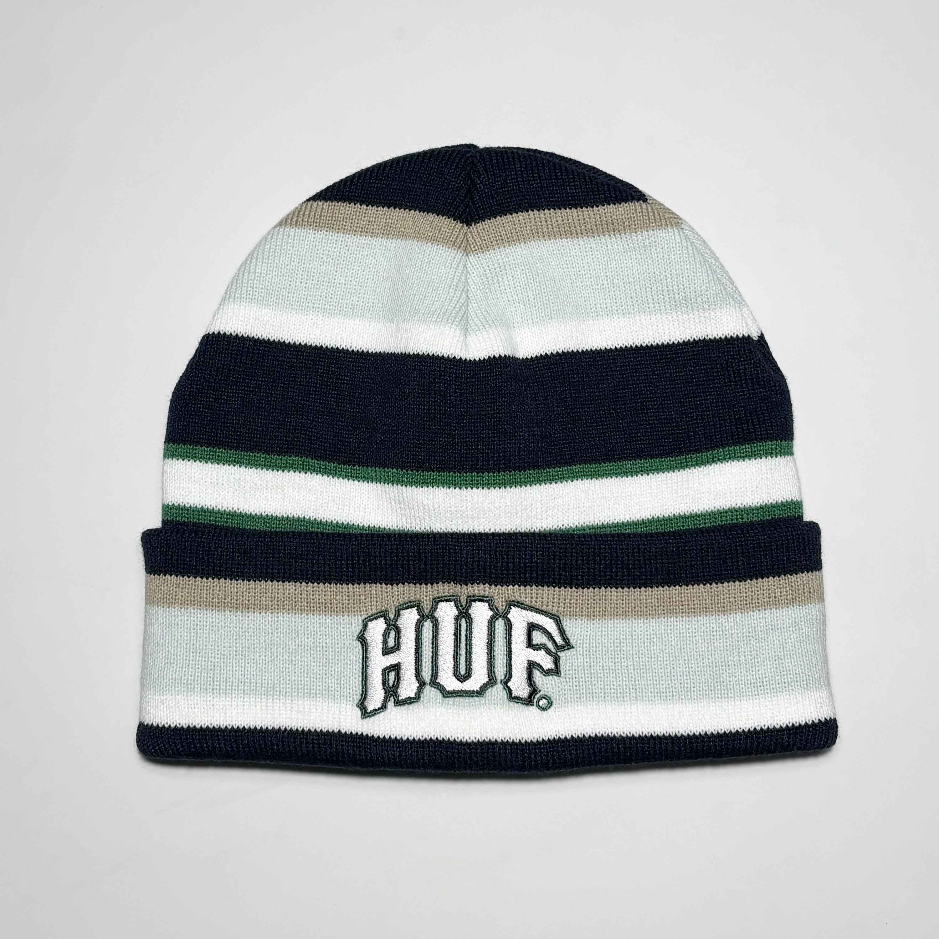 Striped beanie with embroidered HUF logo on fold.