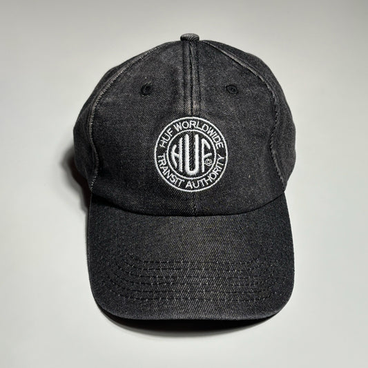 Front image of black denim hat with HUF logo embroidered on crown. 