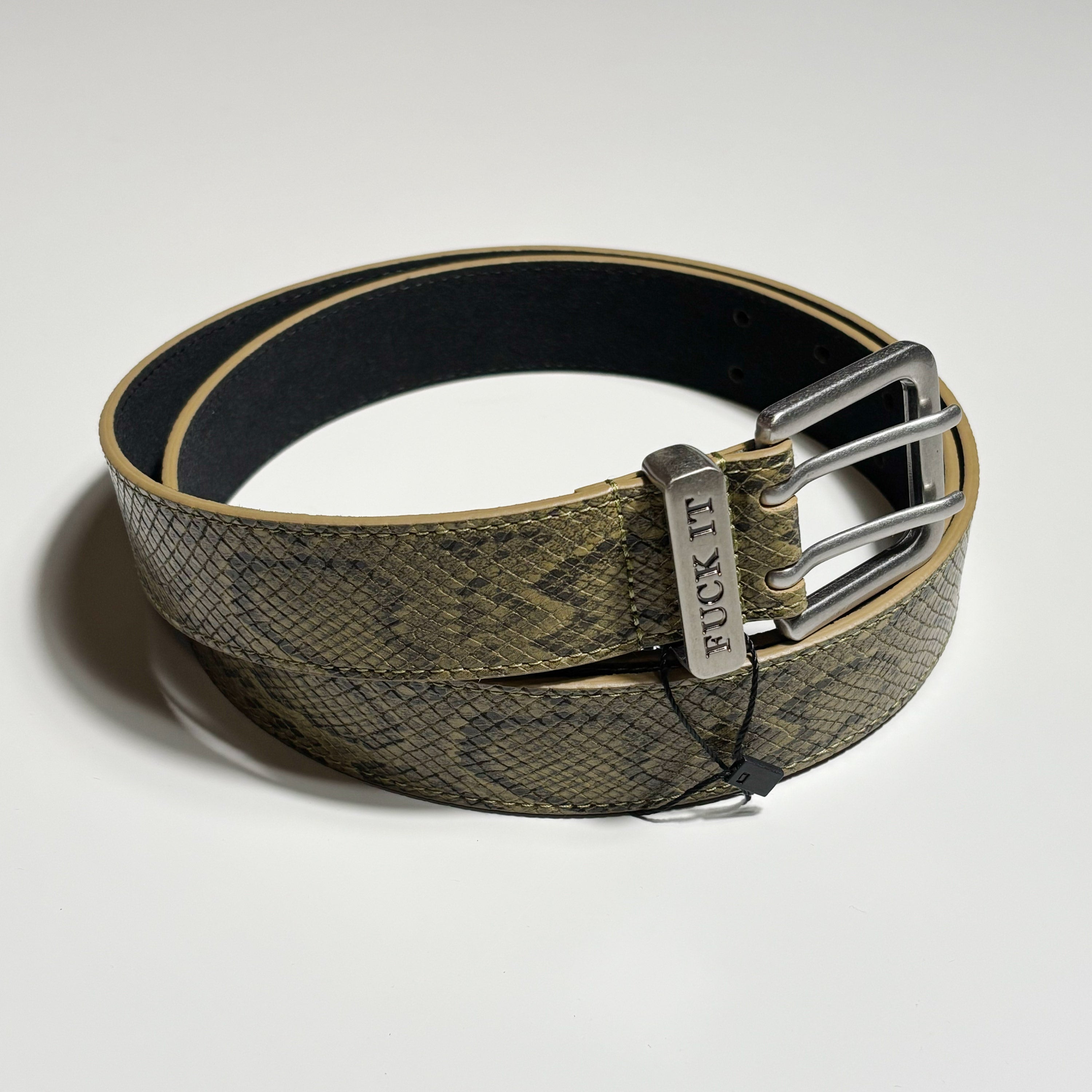 Belt with snake print and metal buckle on a light gray background