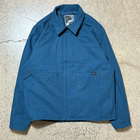 Full image of jacket. Canvas side with chore style pockets. HUF woven label on pocket.