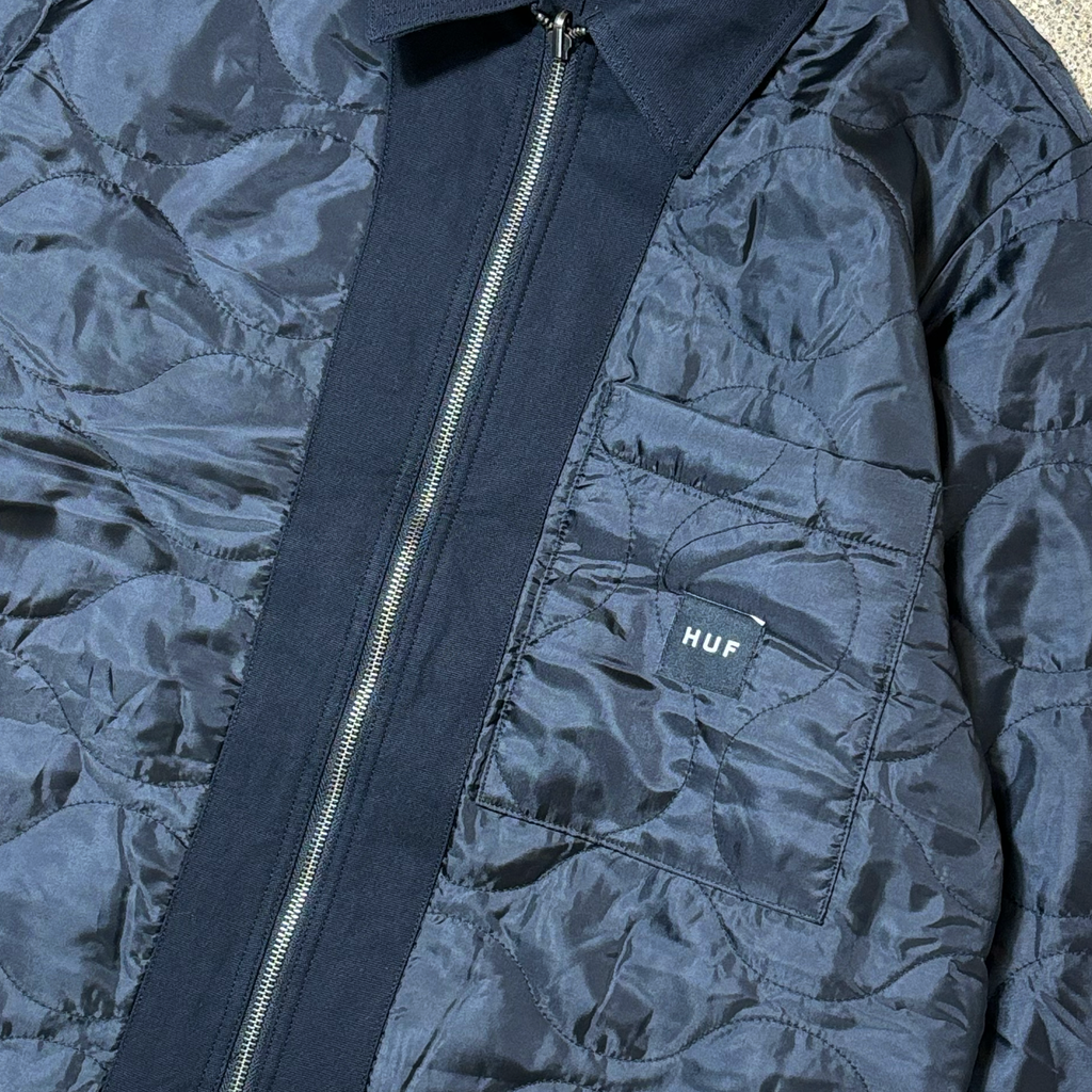 Close detail of quilted side. Chest pocket with black woven label.