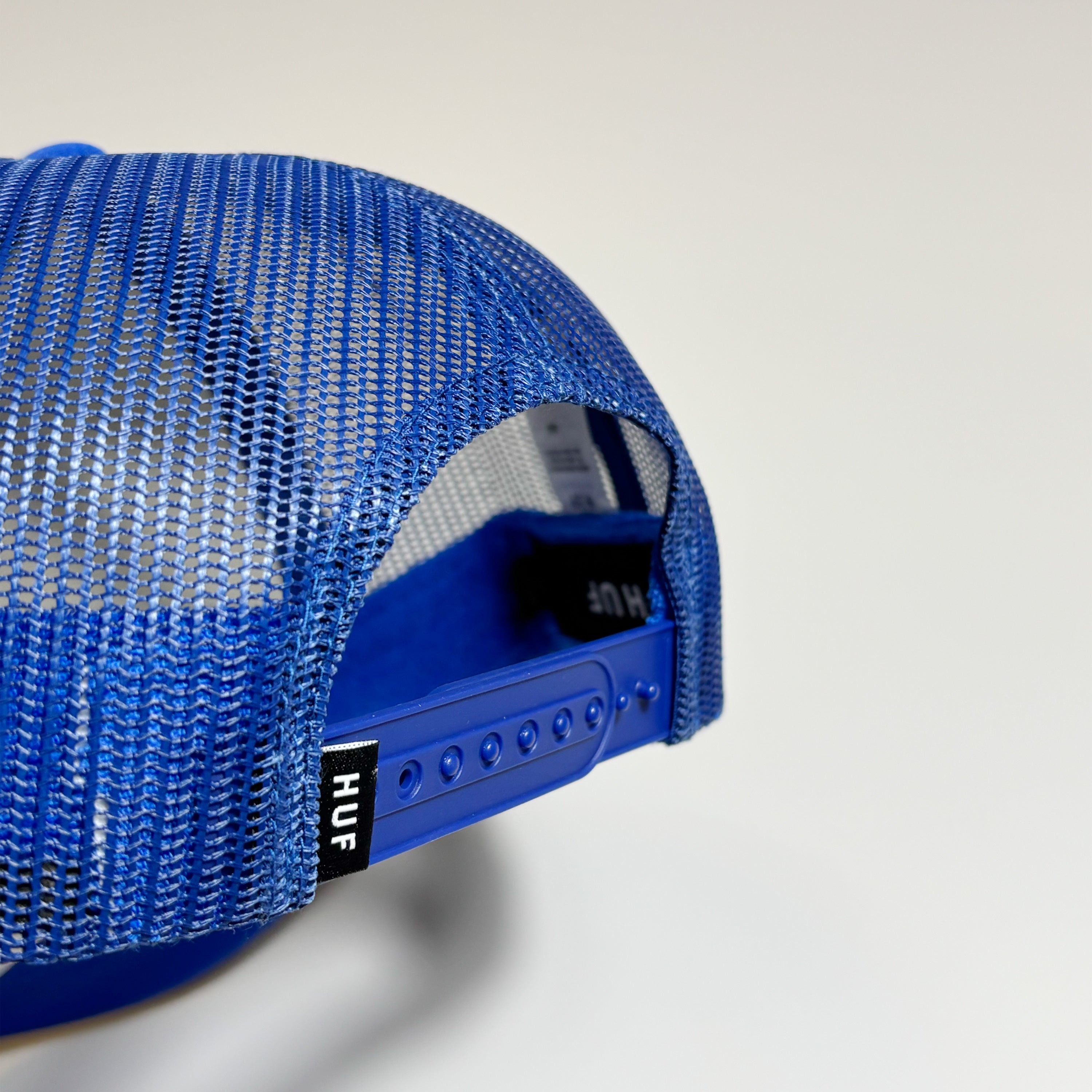 Snapback closure detail with woven label 