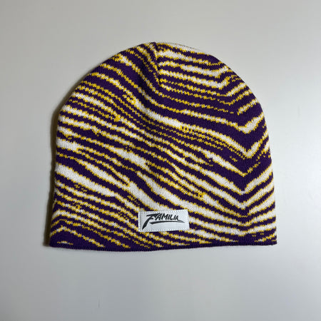 Zubaz striped beanie in purple, white and yellow with zubaz font familia patch.