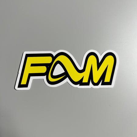 Full image of yellow and black sticker, saying FAM with the adio footwear A