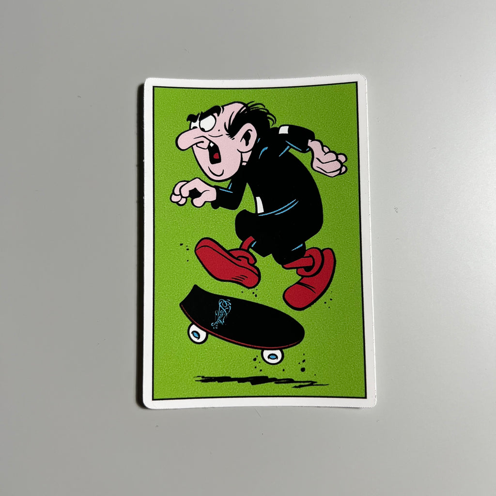 Full image of green vinyl sticker. Gargamel doing a tre flip art. 